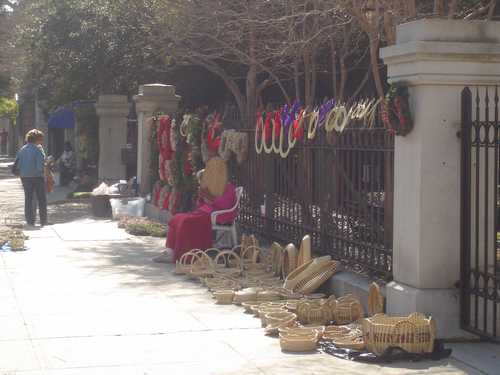 Charleston basketmaker selling basket and wreaths at Christmas